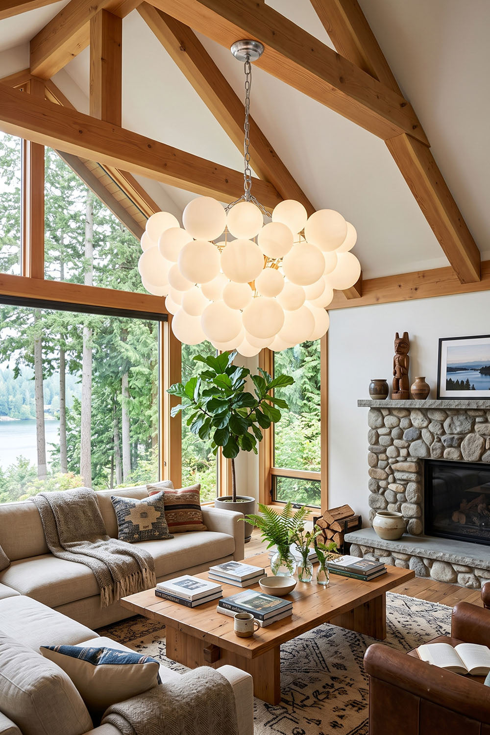 Romilly Frosted Globe Cluster Chandelier | Frosted Glass and Brass | Hanging in a cozy living room with a vaulted wood ceiling and stone fireplace | Samu Lamp