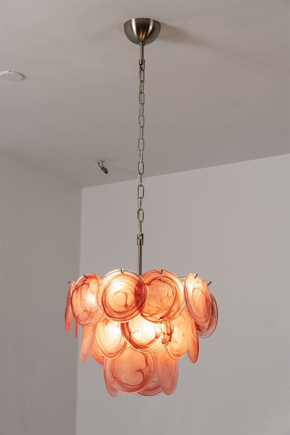Romilly Layered Glass Disc Chandelier featuring a stunning design with layered glass discs in peach tones.