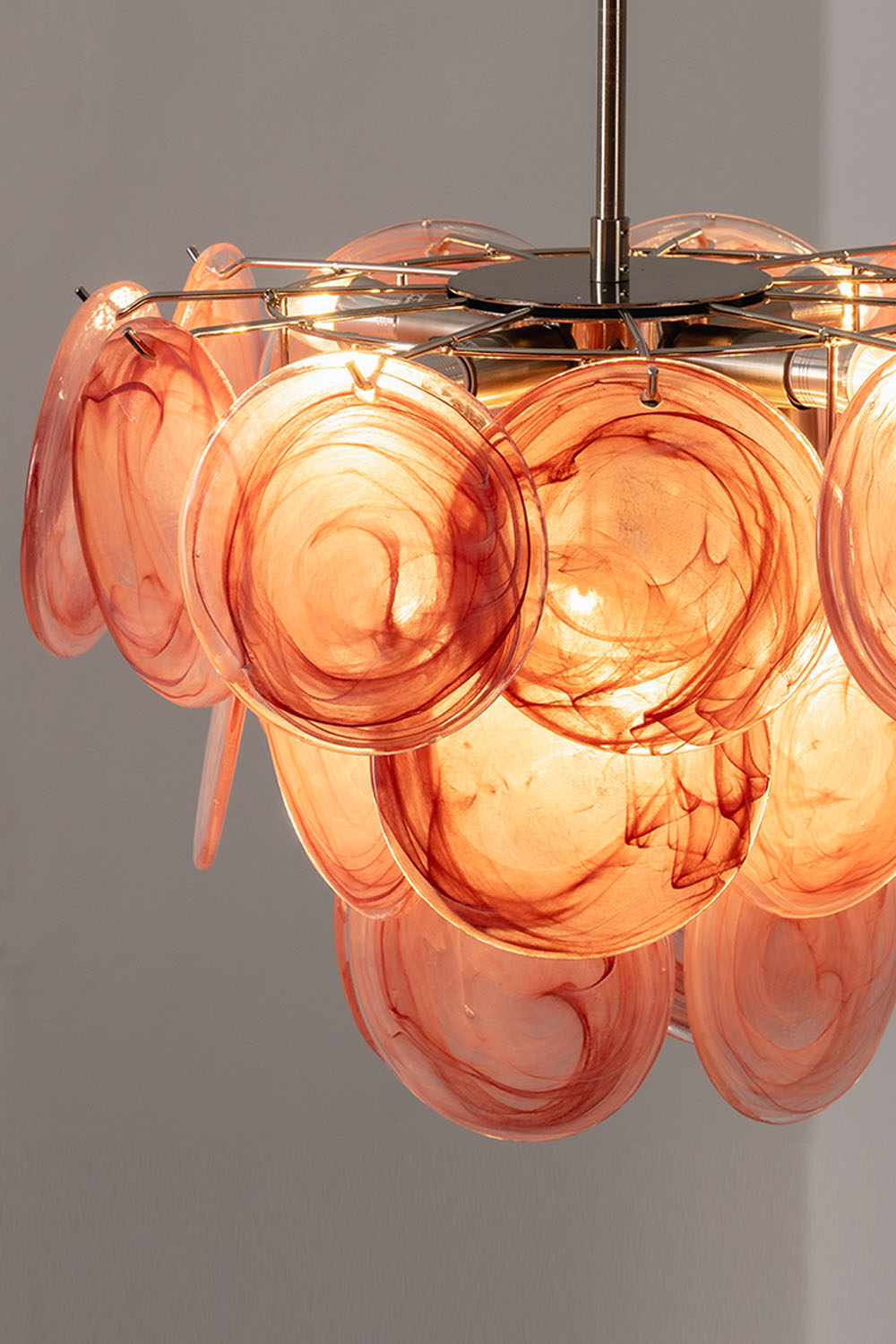 Romilly Layered Glass Disc Chandelier featuring layered glass discs in soft pink tones.
