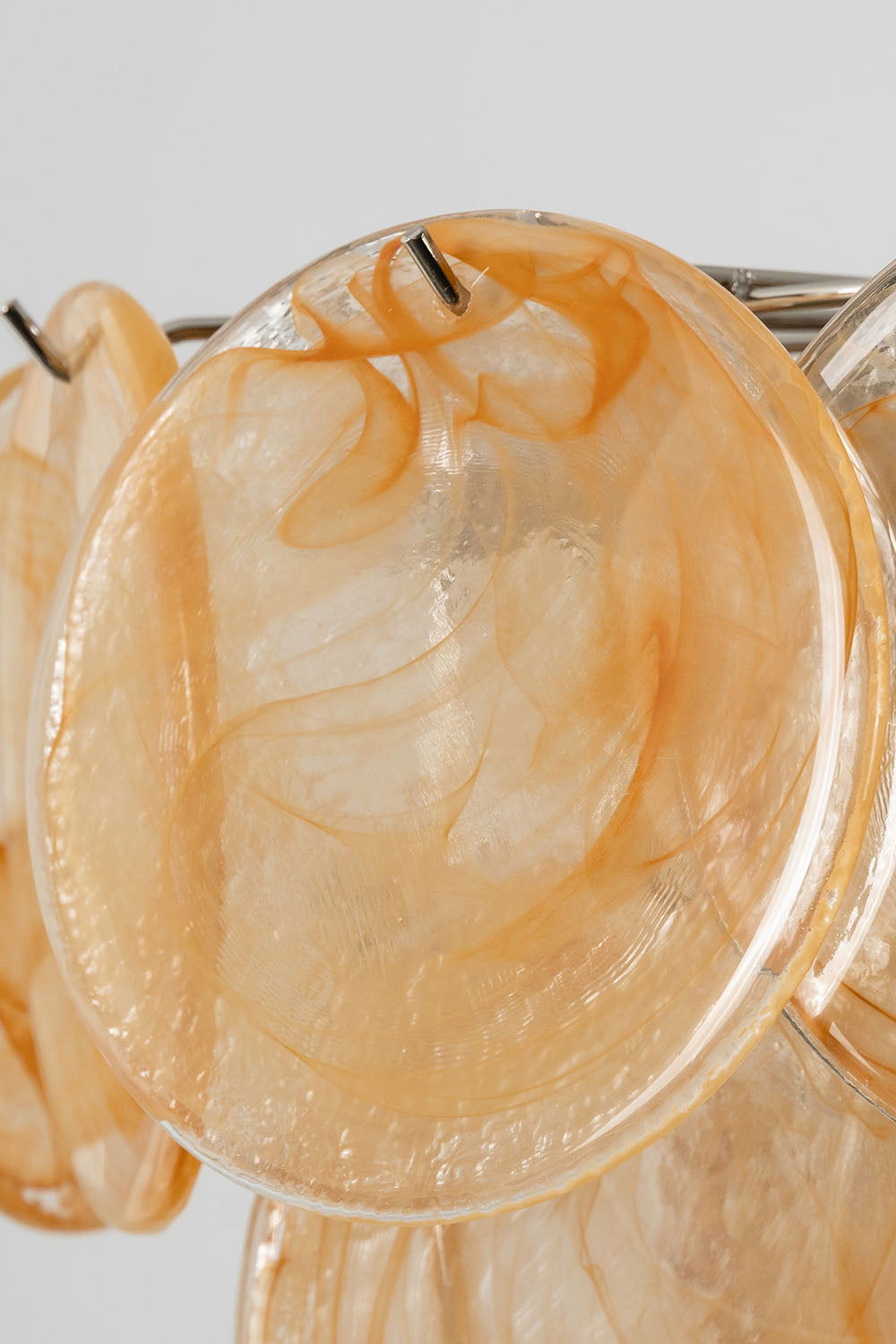 Romilly Layered Glass Disc Chandelier featuring elegant layered glass discs in soft orange hues.
