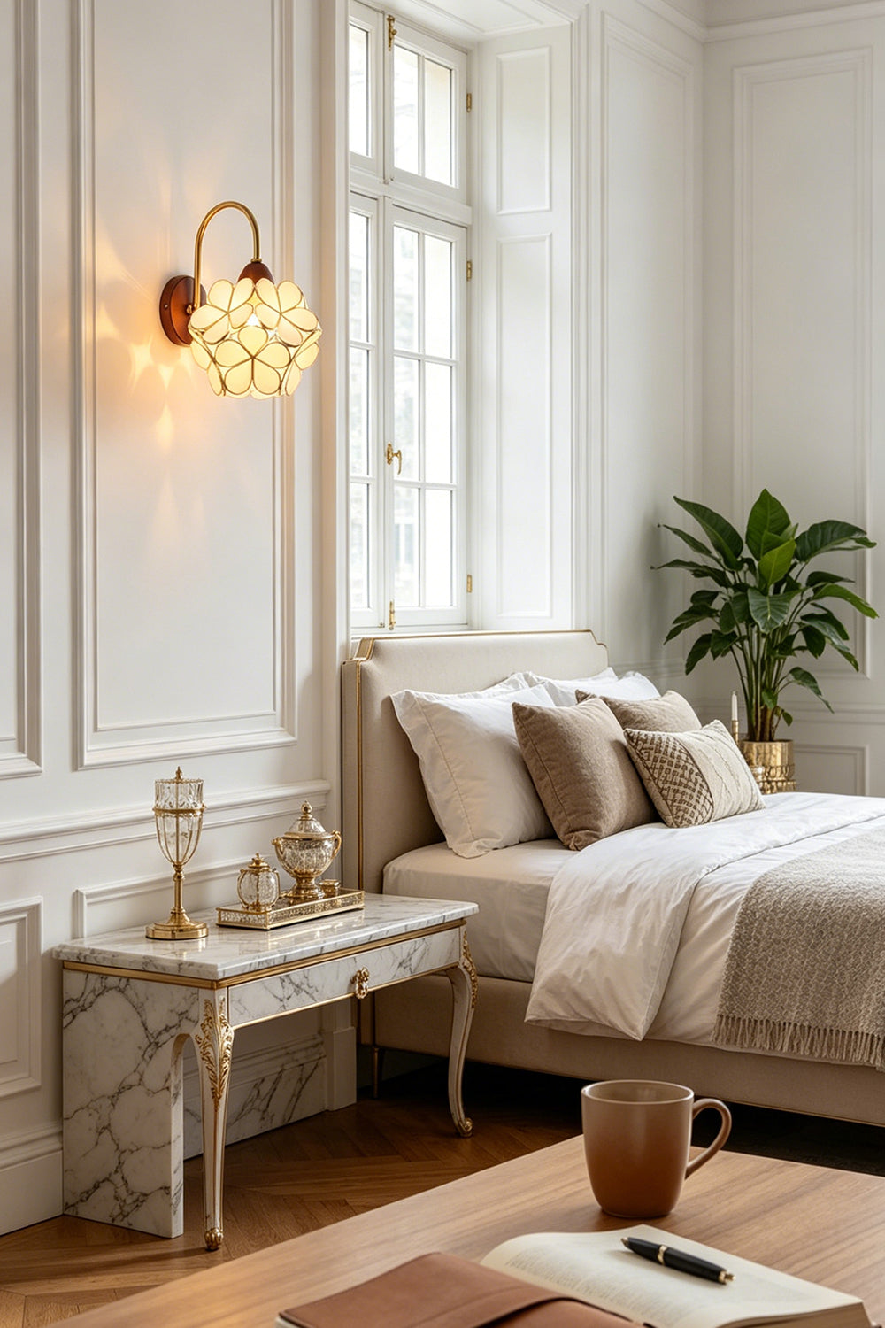 Rosalind Petal Glass Botanical Wall Lamp | Glass, Metal, Wood | Installed as a charming bedside reading light on a white paneled wall next to a bed with neutral linens | Samu Lamp