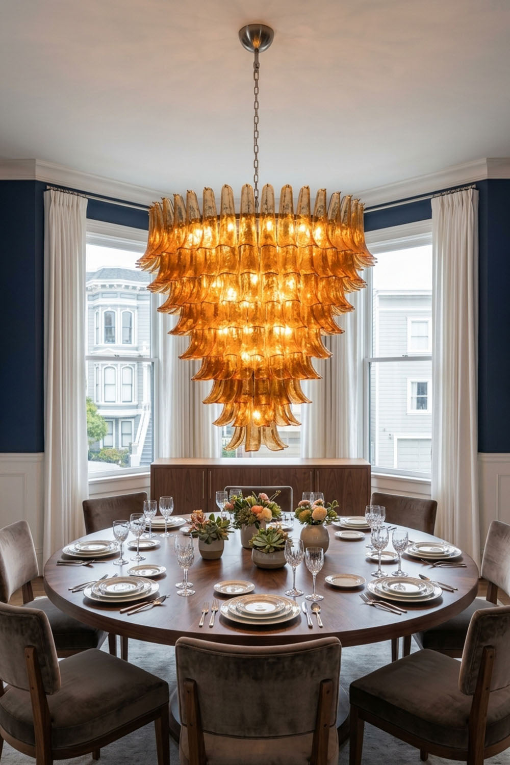 Rouveline Rippled Amber Glass Cone Chandelier | Rippled Amber Glass and Metal | Hanging above a round dining table in an elegant dining room | Samu Lamp