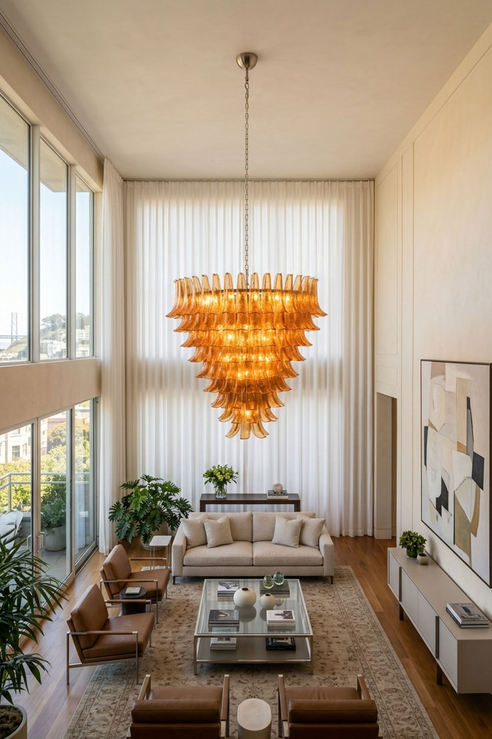 Rouveline Rippled Amber Glass Cone Chandelier | Rippled Amber Glass and Metal | Styled in a bright spacious lounge area near tall windows | Samu Lamp