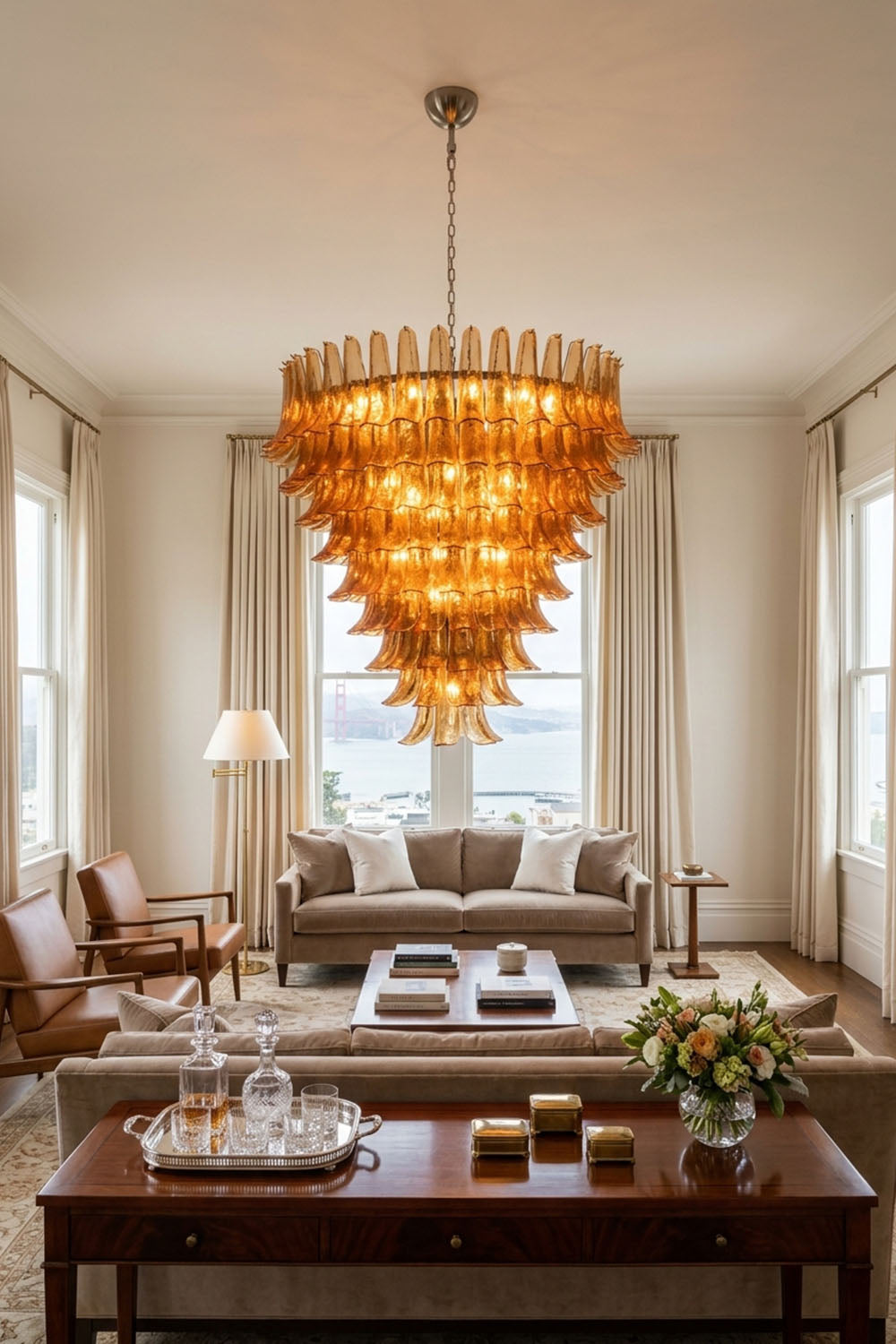 Rouveline Rippled Amber Glass Cone Chandelier | Rippled Amber Glass and Metal | Real-life installation view in a living room with coffee table | Samu Lamp