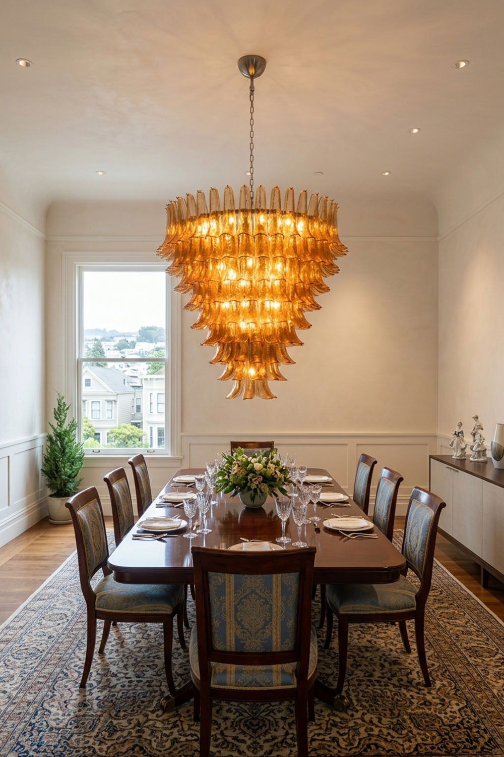 Rouveline Rippled Amber Glass Cone Chandelier | Rippled Amber Glass and Metal | Illuminating a formal dining room over a long wooden table | Samu Lamp