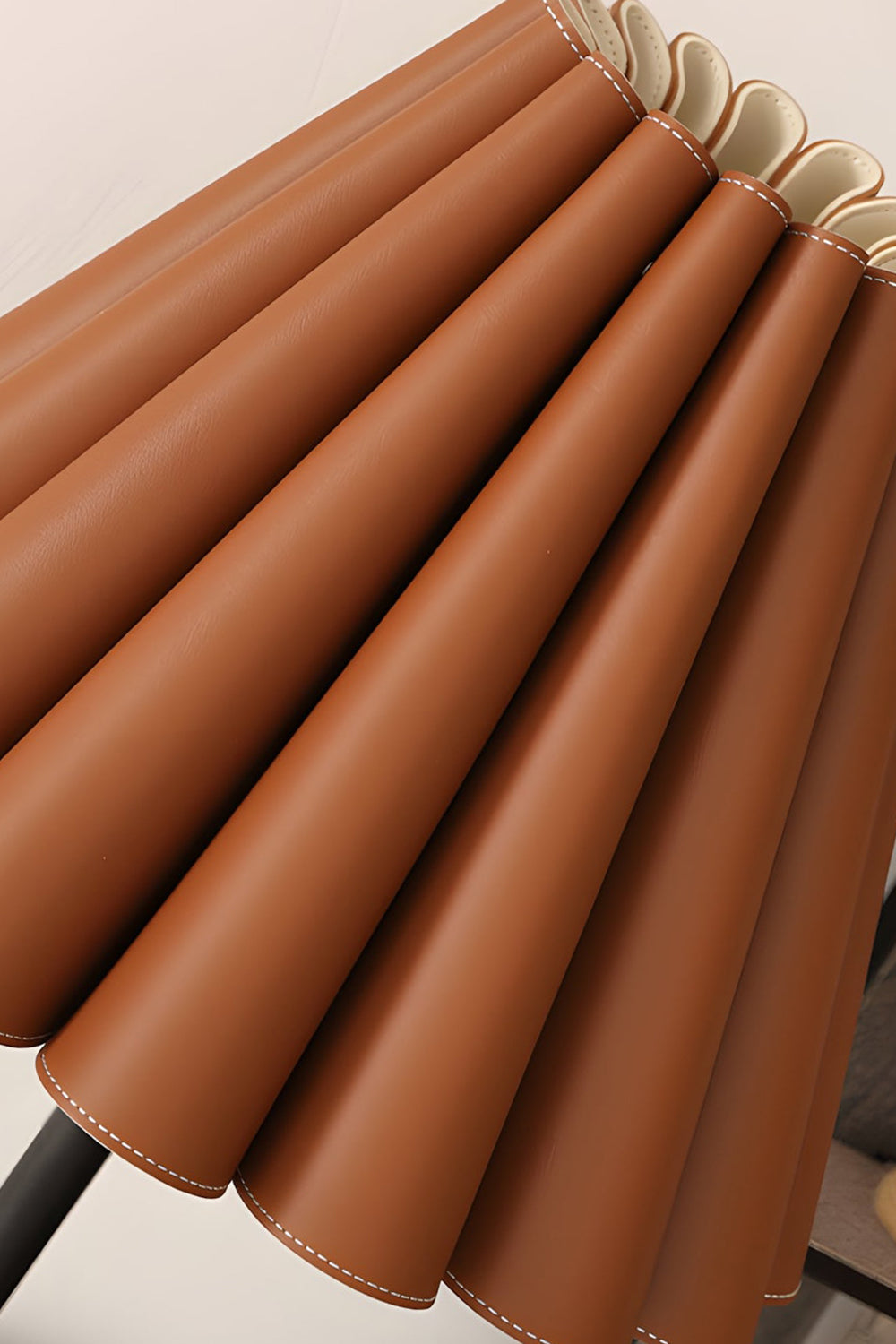 Rowan Leather Pleated Table Lamp | Leather, Metal | Macro close-up view highlighting the rich texture, crisp folds, and fine details of the tan pleated leather shade | Detail shot | Samu Lamp