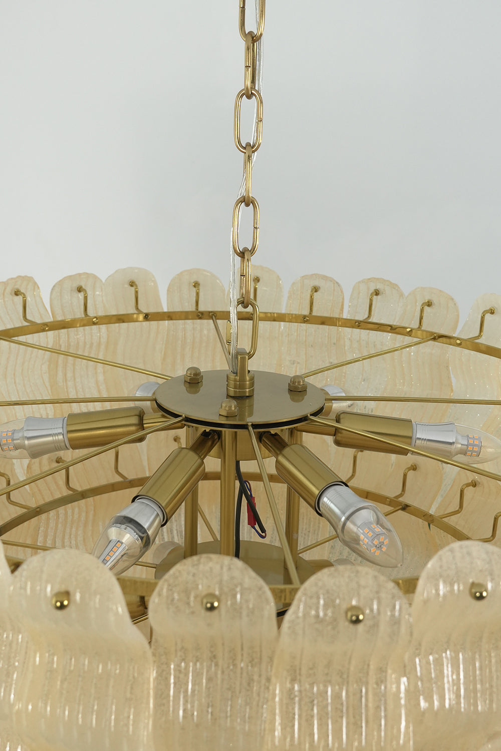 Internal structure and bulb sockets of glass chandelier | Metal | Glass | Top-down view showing the tiered metal frame | Samu Lamp