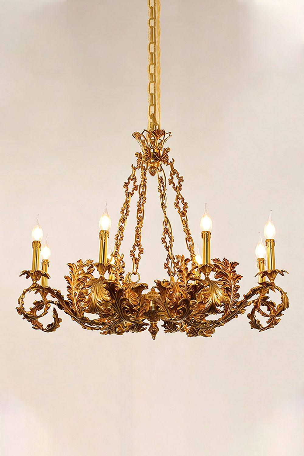 Rurik Acanthus Leaf Brass Chandelier featuring intricate floral design and six candle-like lights, perfect for elegant decor.