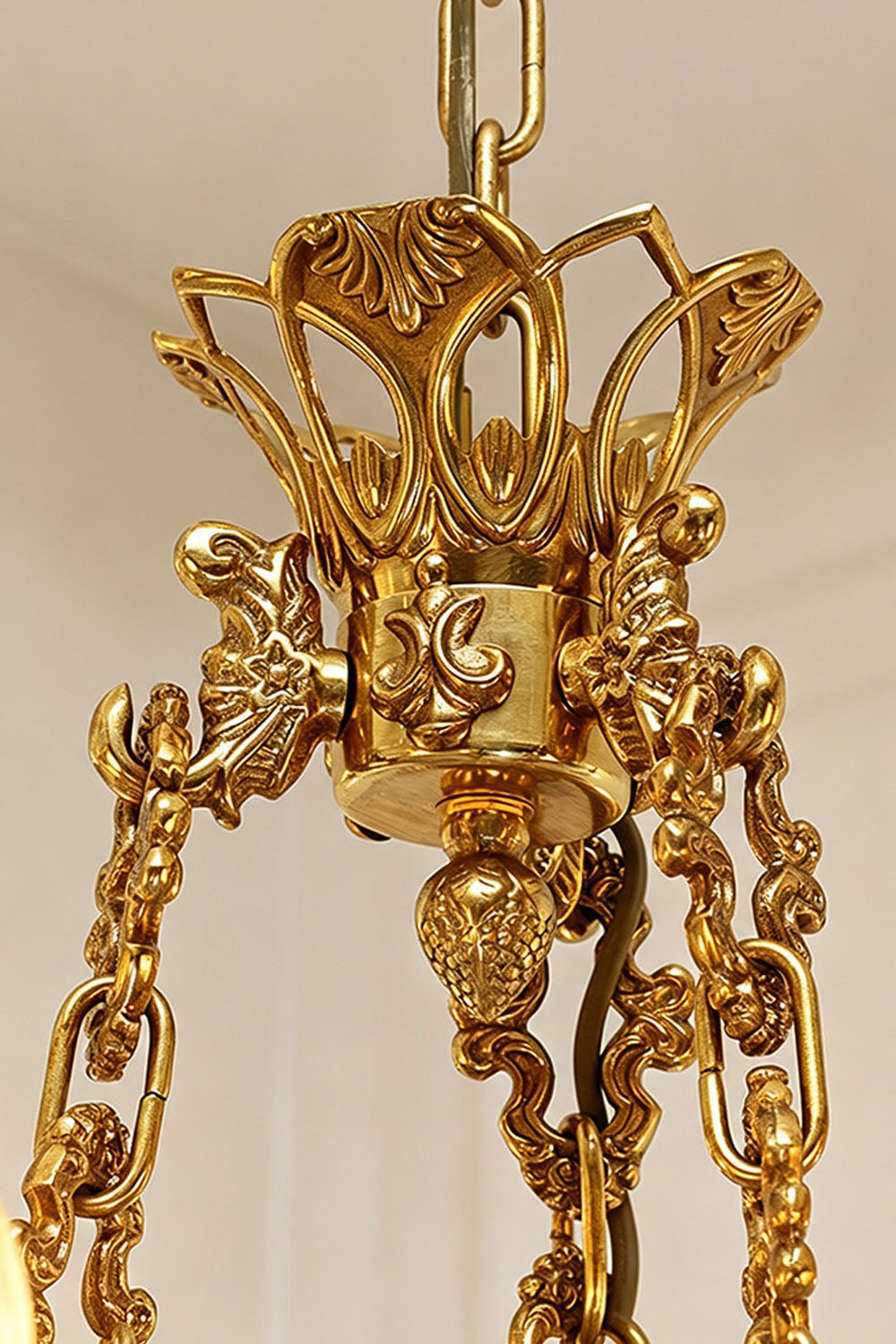 Rurik Acanthus Leaf Brass Chandelier with intricate design and gold finish, highlighting delicate leaf patterns.