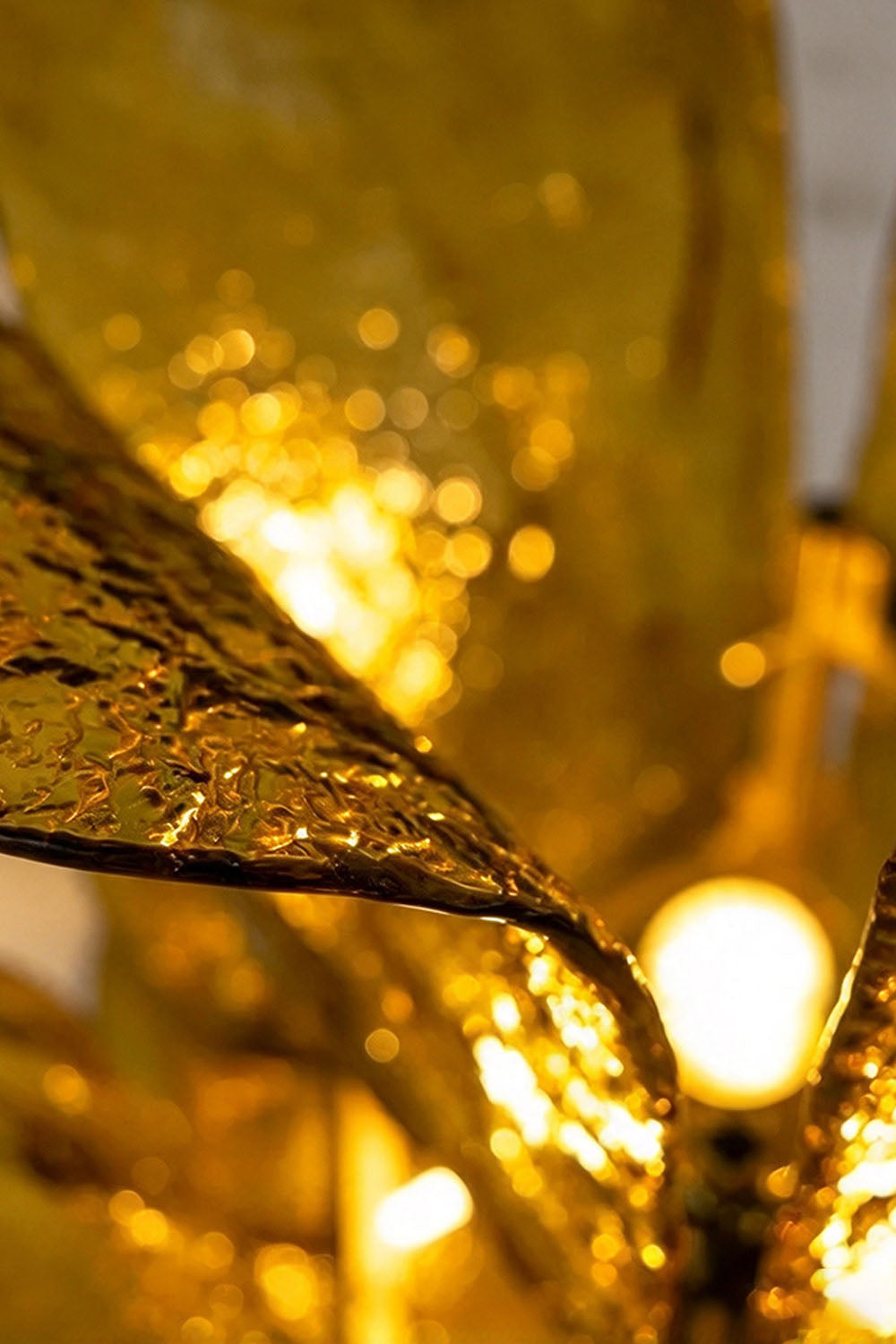 Saubrenne Glass Leaf Tiered Floor Lamp | Textured Glass and Brass | Close-up view of glowing textured glass leaf petals and internal bulb lights | Samu Lamp