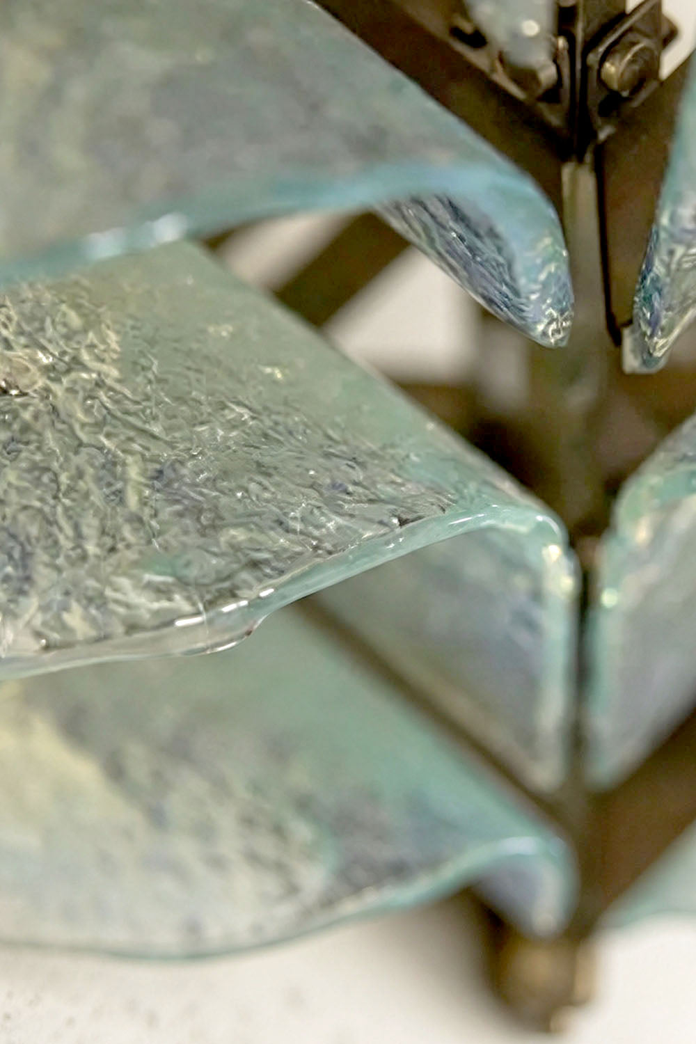 Saubrenne Glass Leaf Tiered Floor Lamp | Textured Glass and Brass | Macro close-up shot highlighting the clear ice textured glass leaf surface | Samu Lamp