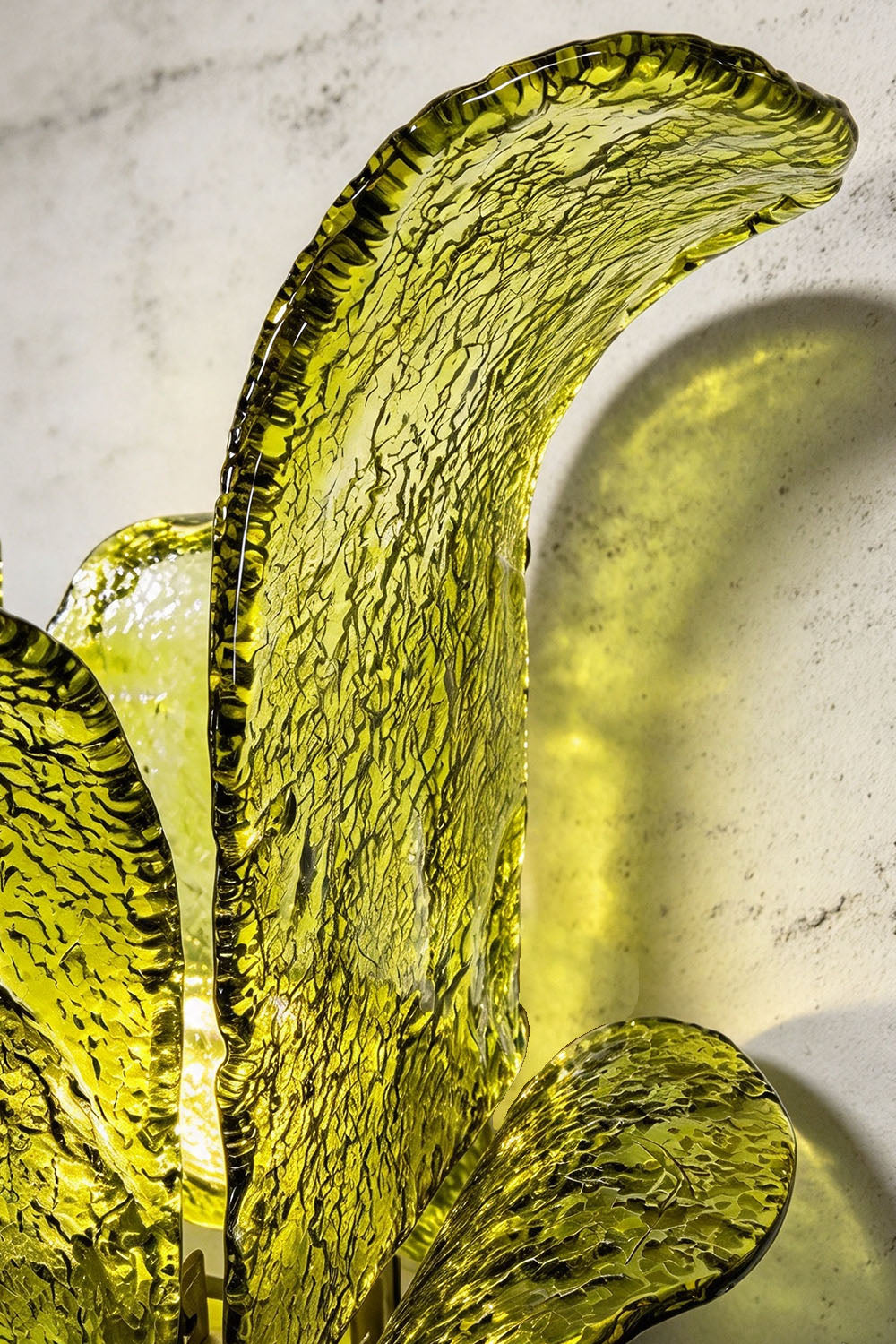 Saubrenne Glass Leaf Tiered Floor Lamp | Textured Glass and Brass | Detail shot of the top curved green glass leaf against a marble background | Samu Lamp