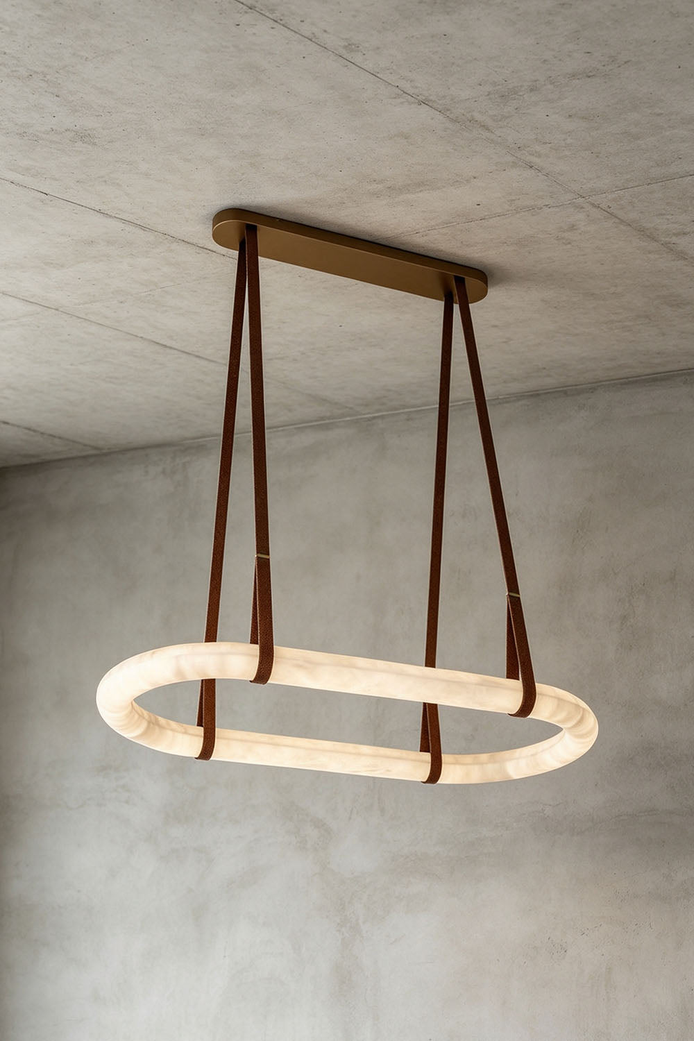 Selwyn Racetrack Alabaster Leather Pendant Light | Natural Alabaster, Leather and Metal | Side view of the glowing racetrack alabaster pendant light | Samu Lamp