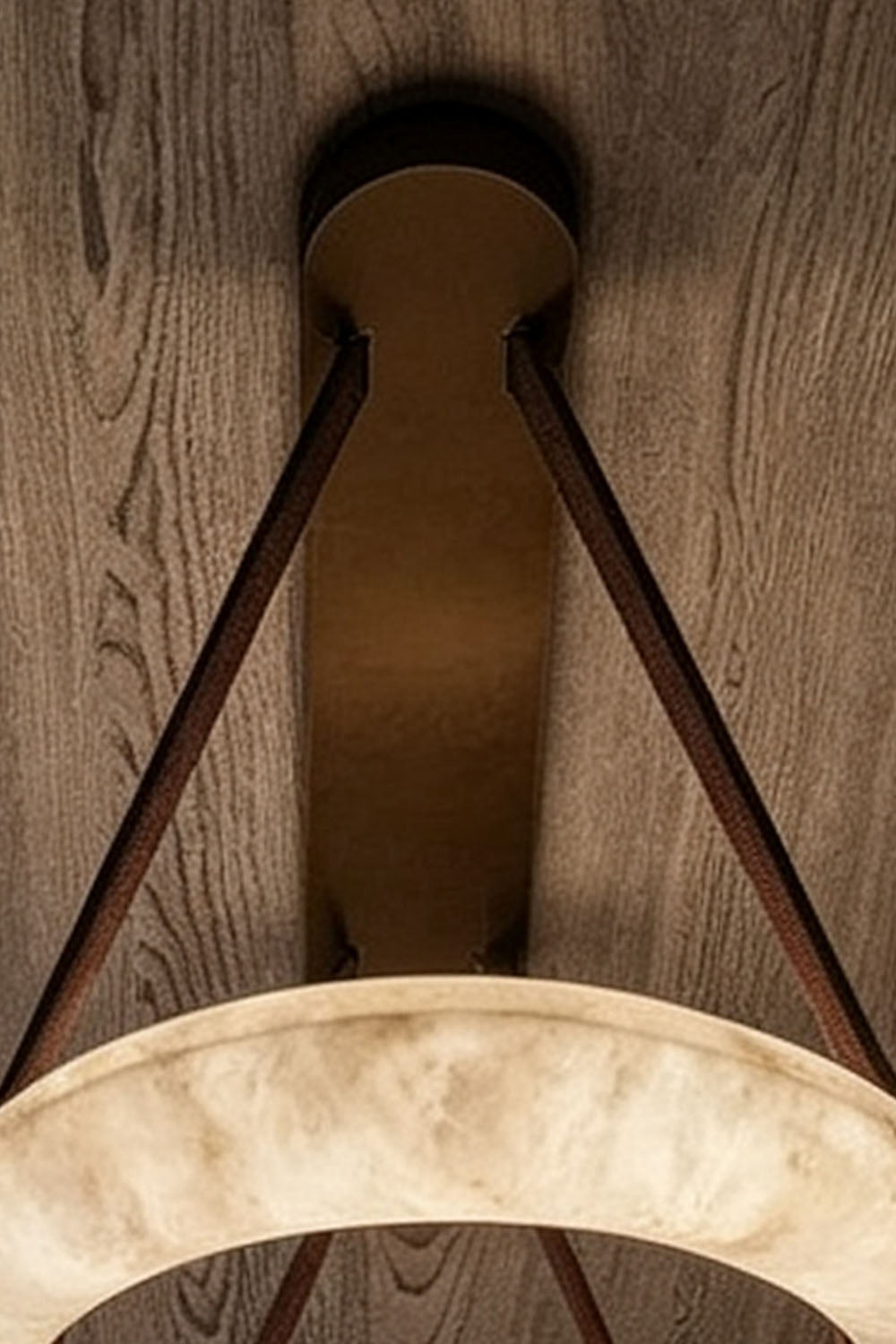Selwyn Racetrack Alabaster Leather Pendant Light | Natural Alabaster, Leather and Metal | Close-up view showing top ceiling canopy and brown leather suspension straps | Samu Lamp