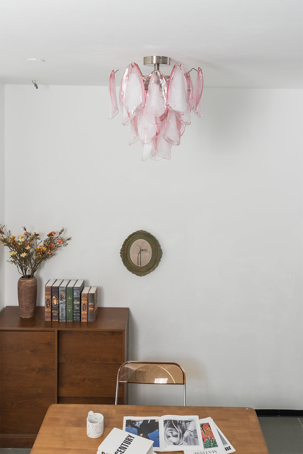 Pink petal glass ceiling light against a neutral wall | Metal, Glass | Side view showing the cascading petal layers | Samu Lamp