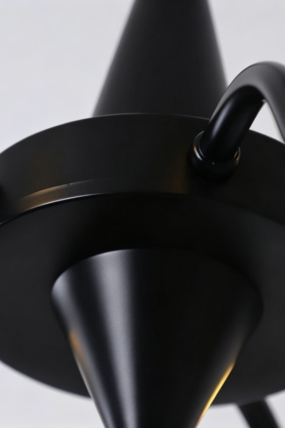 Seraphina Stained Glass Chandelier | Glass, Metal | Close-up focus on the matte black metal central body hub and curved arm connections | Detail shot | Samu Lamp