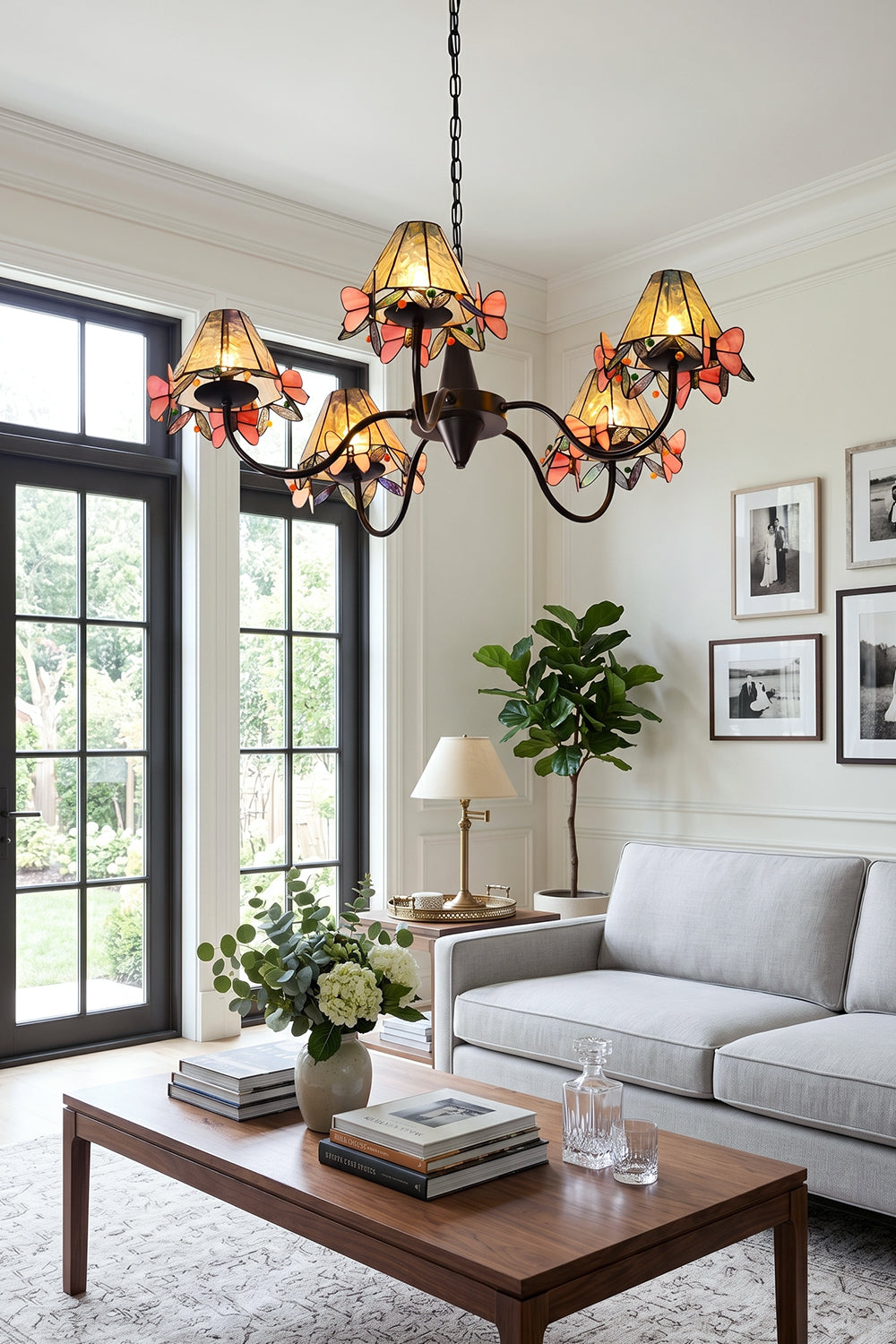 Seraphina Stained Glass Chandelier | Glass, Metal | Positioned as central lighting in a sunlit living room with comfortable grey sofas and a wooden coffee table | Samu Lamp
