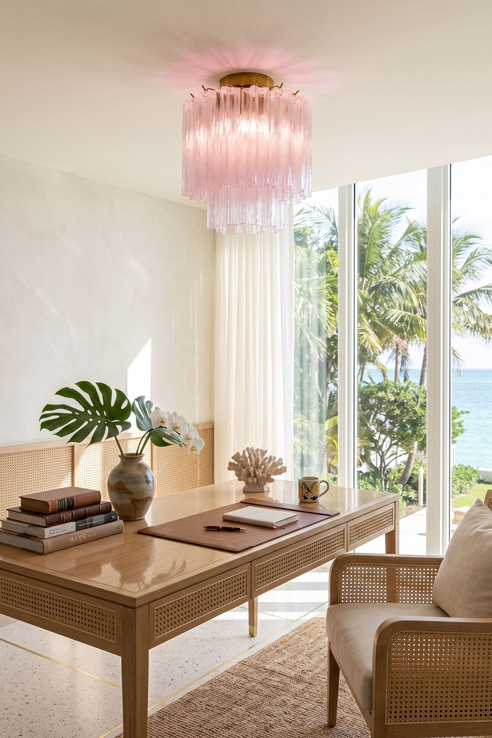 Seraphine Starburst Glass Tube Ceiling Light | Pink Glass and Brass | Styled in a modern study room near a large window with tropical plants | Samu Lamp