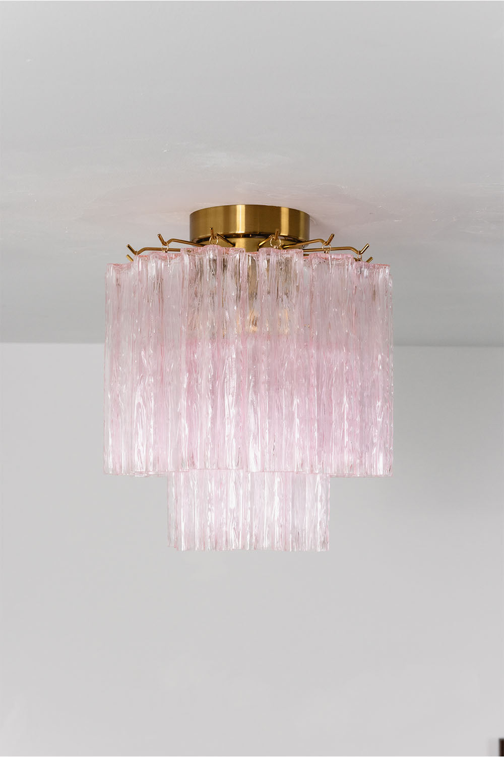 Seraphine Starburst Glass Tube Ceiling Light | Pink Glass and Brass | Front illuminated view mounted against a plain white backdrop | Samu Lamp