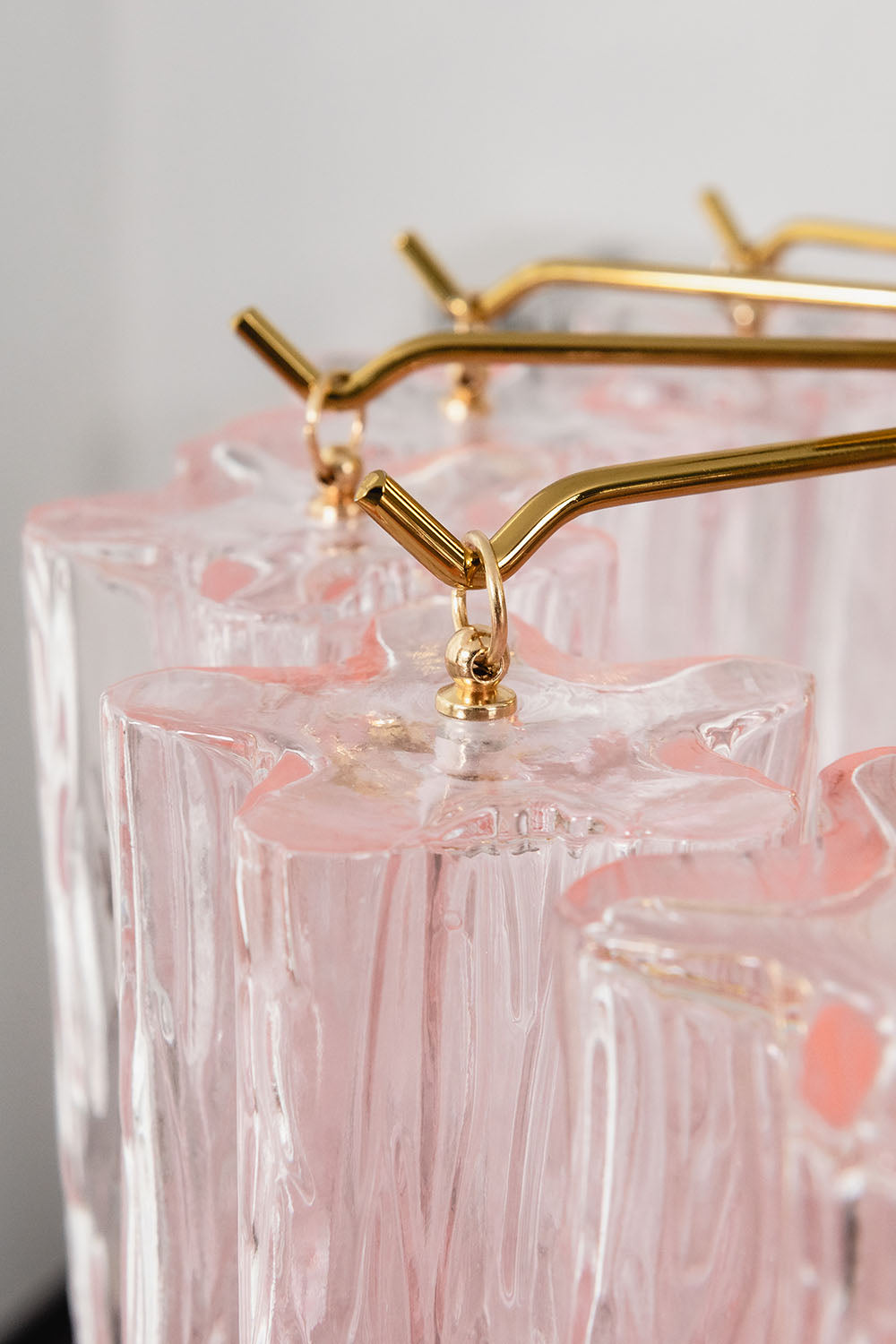 Seraphine Starburst Glass Tube Ceiling Light | Pink Glass and Brass | Macro close-up of the brass branches holding the pink glass tubes | Samu Lamp