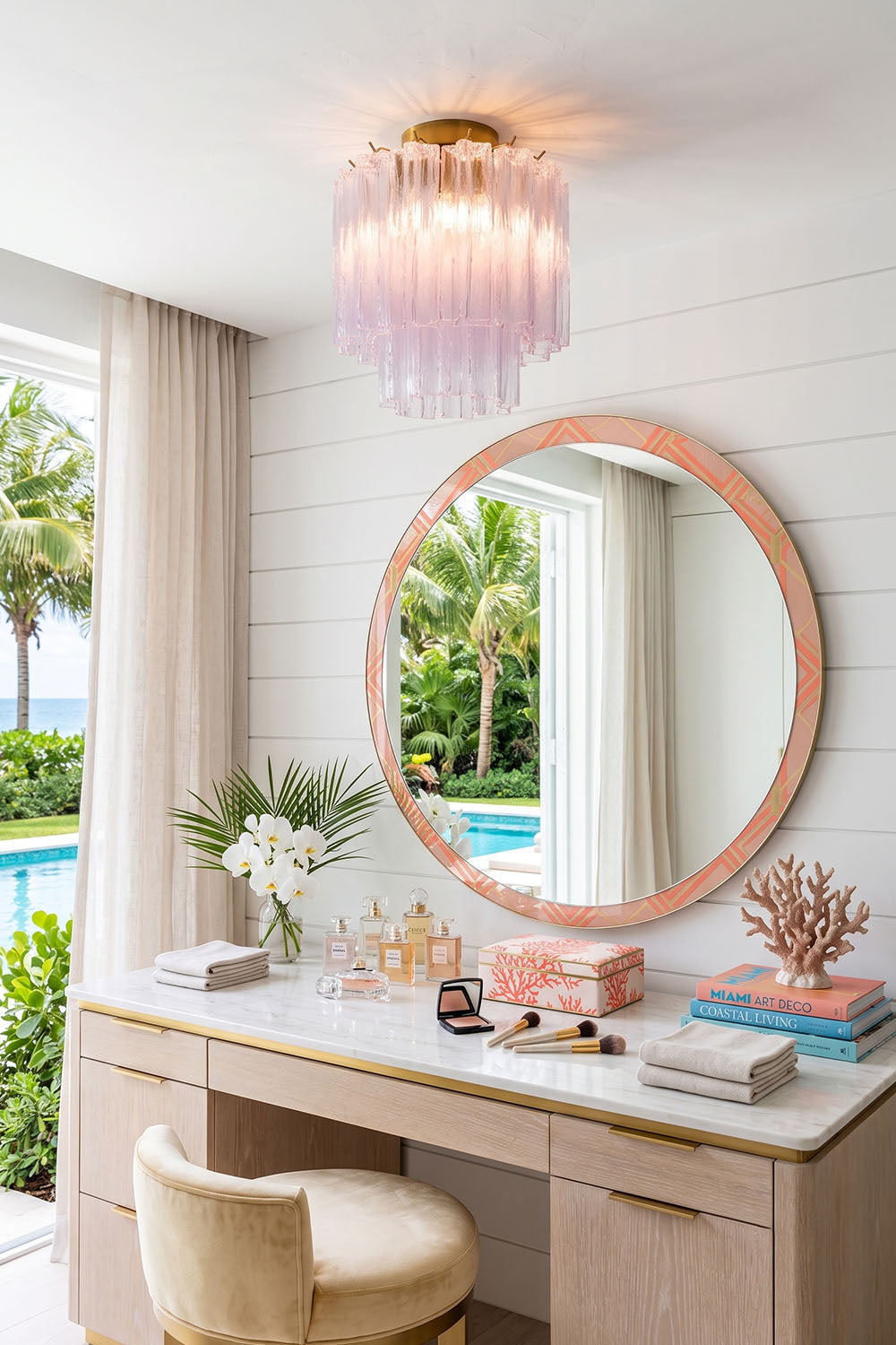 Seraphine Starburst Glass Tube Ceiling Light | Pink Glass and Brass | Displayed above an elegant vanity dressing table with a round mirror | Samu Lamp
