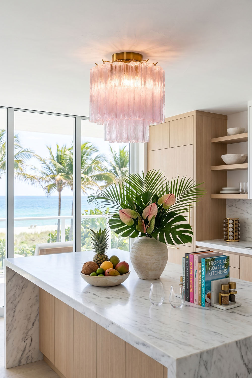 Seraphine Starburst Glass Tube Ceiling Light | Pink Glass and Brass | Centered above a marble kitchen island in a sunlit room | Samu Lamp