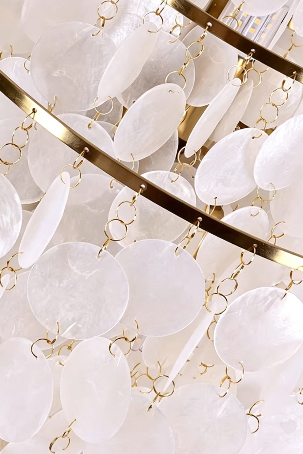 Internal iron frame detail of shell lamp | Shell | Iron | Close-up of gold-finish rings and shell attachments | Samu Lamp