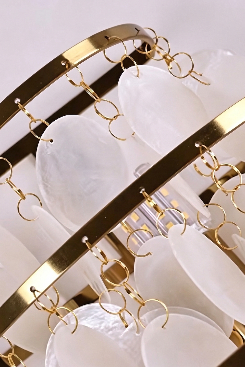 Tiered metal structure of shell wall light | Iron | Top-down detail of the gold-finish iron frame | Samu Lamp