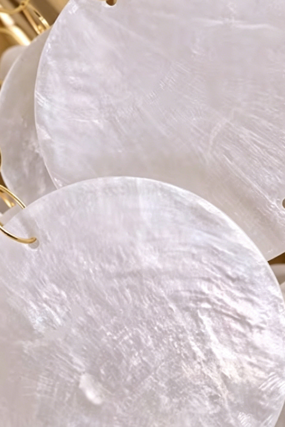 Close-up detail of natural shell discs | Shell | Macro shot showing the iridescent texture and sheen | Samu Lamp