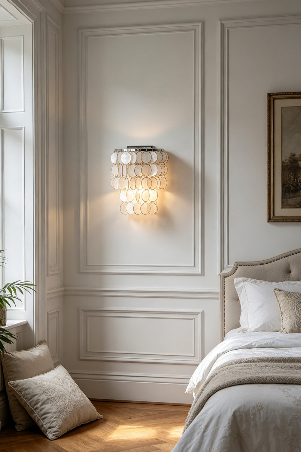 Shimmering Capiz shell wall lamp | Shell | Iron | Bedroom corner scene with neutral tones | Samu Lamp