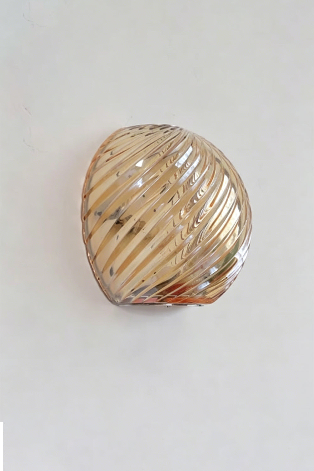 Silas Ribbed Glass Wall Sconce | Ribbed Glass, Metal | Studio unlit view of the champagne amber gold ribbed glass finish option showcasing its warm metallic tinted reflection | Samu Lamp