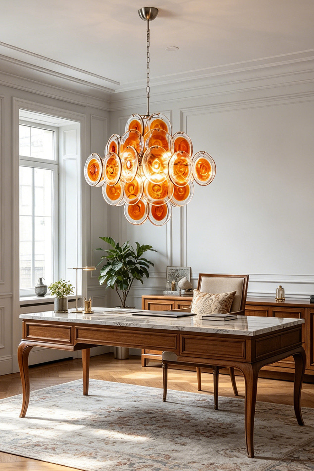 Mid-century modern amber glass chandelier | Metal, Glass | Installed in a spacious home office over a wooden desk | Samu Lamp