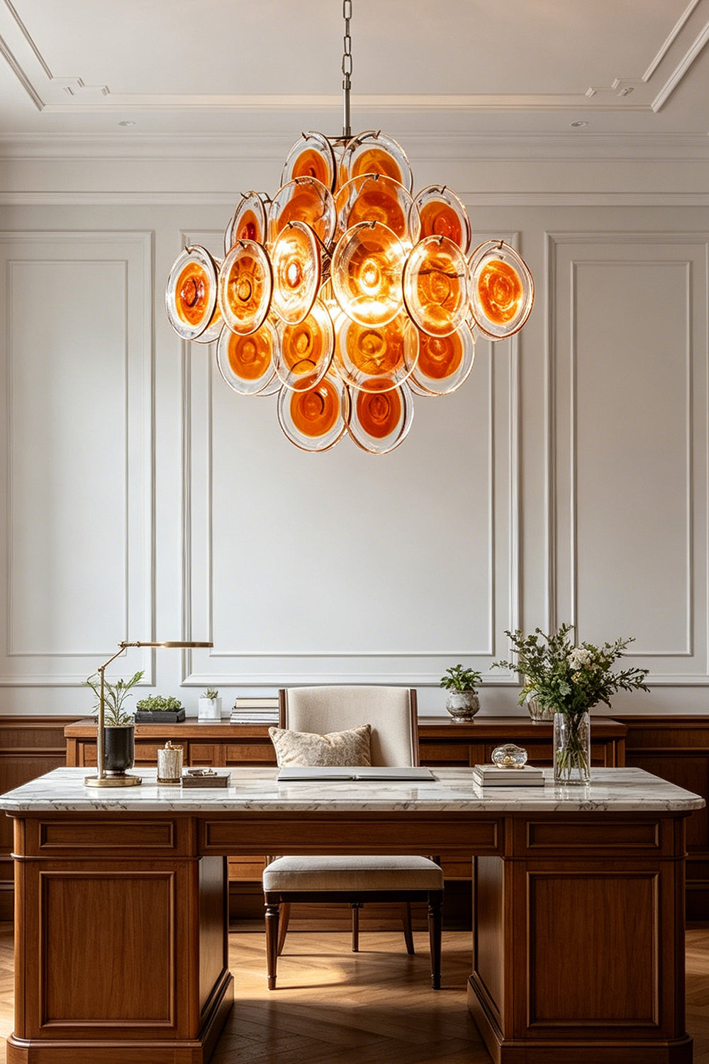 Grand Solari Amber Glass Chandelier | Metal, Glass | Centered view in a luxury study over a white-top desk | Samu Lamp