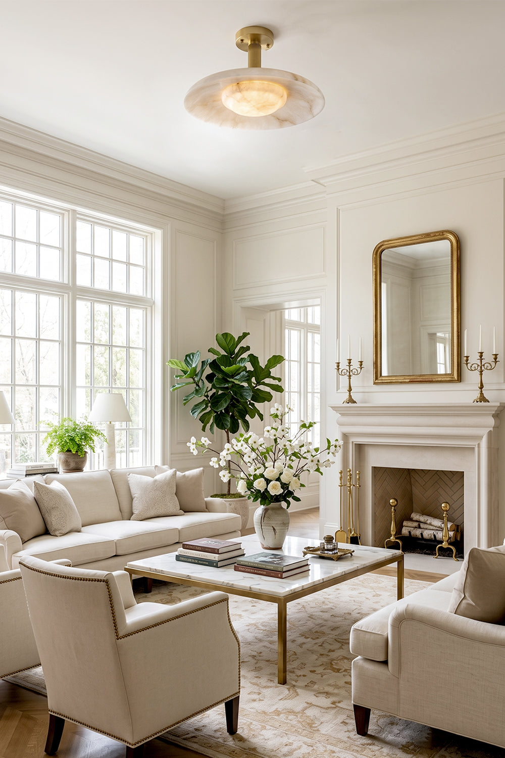 Solene Alabaster Round Ceiling Light | Living Room Accent Light | Staged in a bright luxury classical living room, radiating a warm cozy halo above cream fabric sofas and a traditional fireplace | Samu Lamp