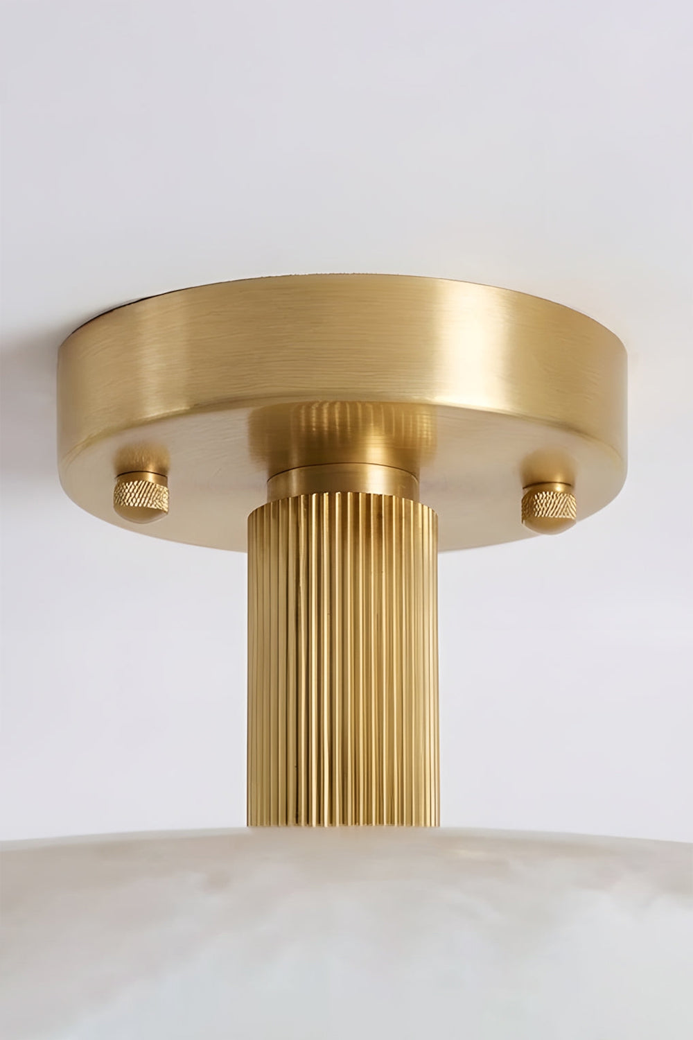 Solene Alabaster Round Ceiling Light | Canopy Detail | Close-up structural view focusing on the premium brushed gold brass circular ceiling canopy and short mounting stem | Detail shot | Samu Lamp