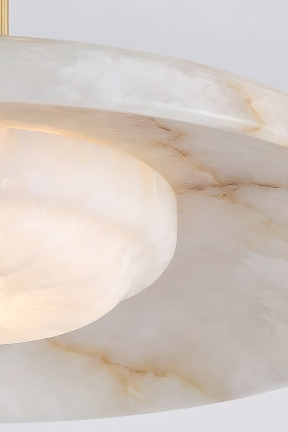 Solene Alabaster Round Ceiling Light | Diffuser Bowl Detail | Close-up view from below looking at the fully illuminated inner alabaster diffuser bowl displaying rich translucent mineral veining | Detail shot | Samu Lamp