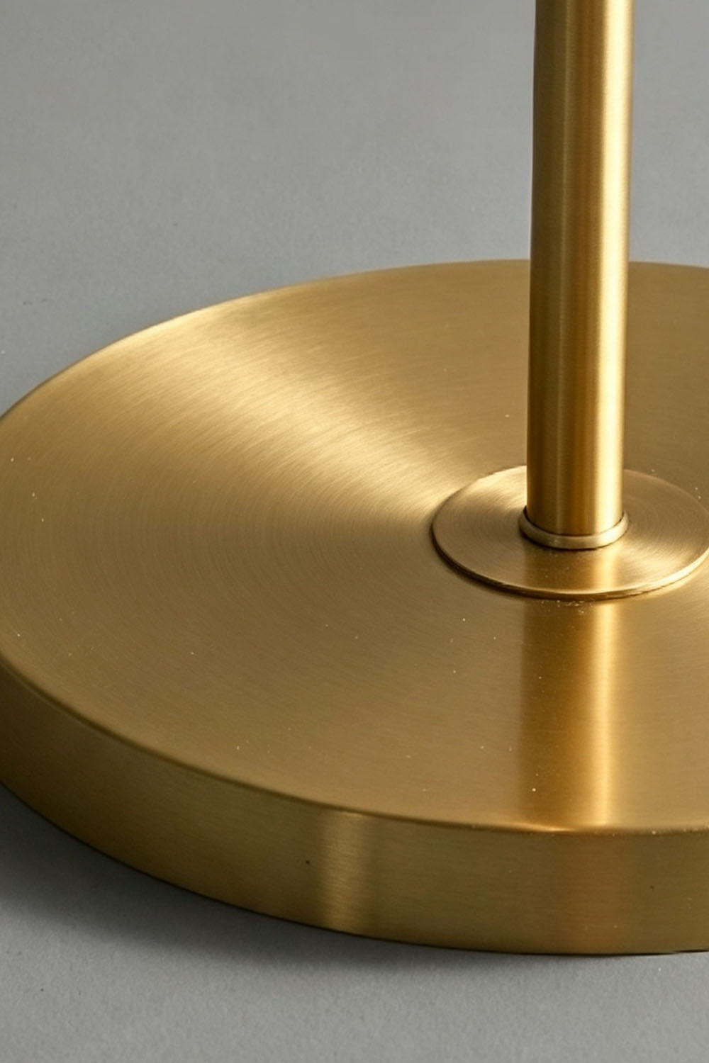 Solene Stacked Glass Table Lamp | Textured Glass and Brass | Close-up view of the smooth circular brass base and stem | Samu Lamp