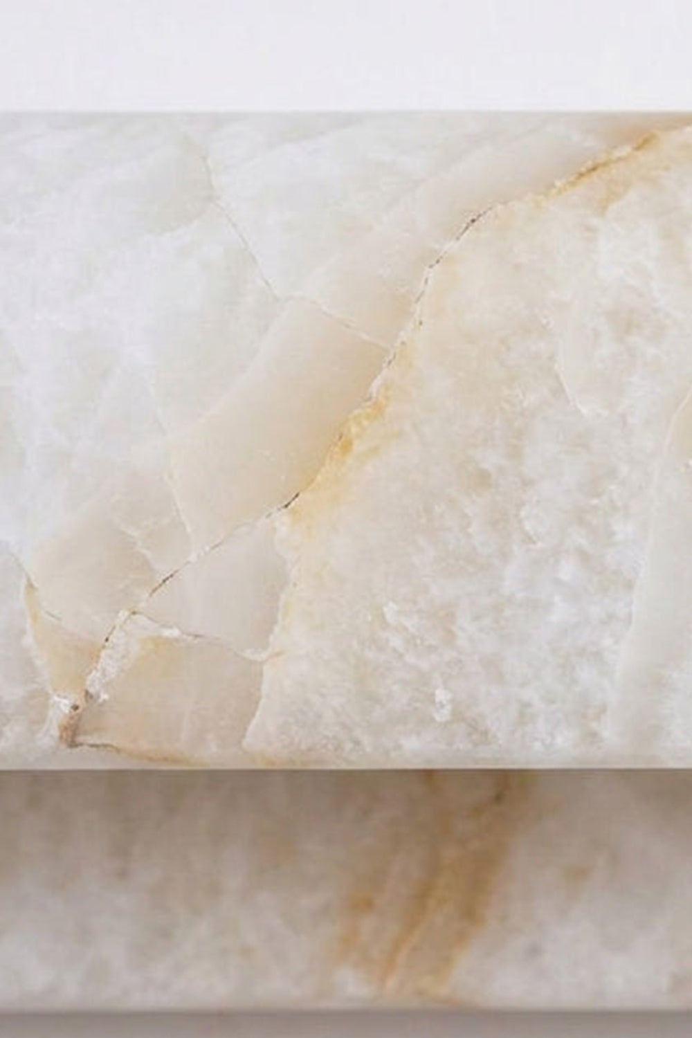 Close-up of natural alabaster showing cloud-like veining suitable for Soren Stacked Alabaster Wall Sconce.