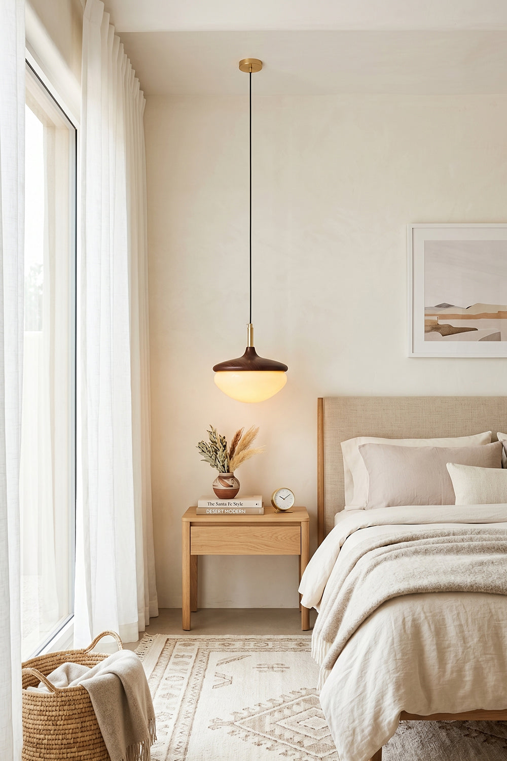 Soren Wood Grain Pendant Lamp | Wood, Glass, Metal | Hanging as a cozy bedside light over a light wood nightstand in a soft cream-toned bedroom | Samu Lamp