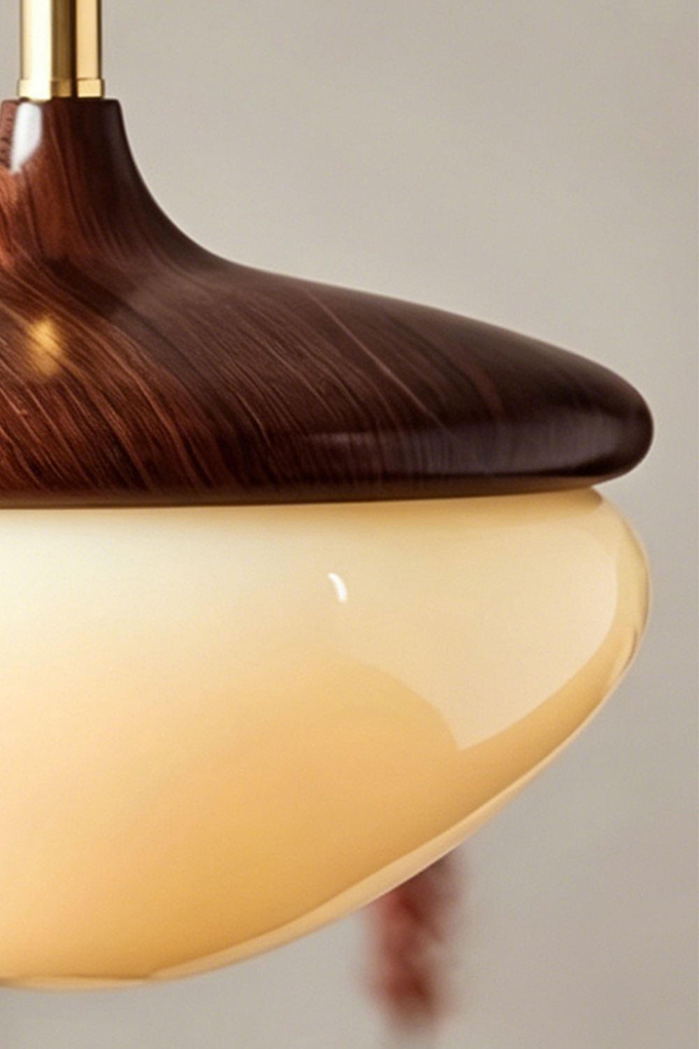 Soren Wood Grain Pendant Lamp | Wood, Glass, Metal | Profile detail shot showcasing the elegant seamless junction between the wood cap and glowing glass diffuser | Samu Lamp