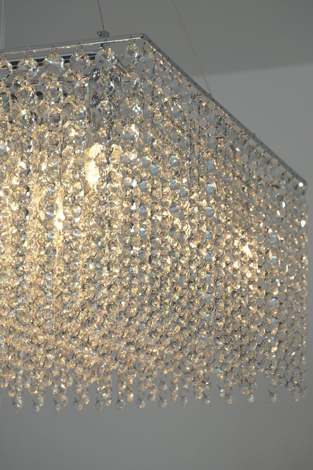 Detailed close-up of sparkling crystal beads and light bulbs | Crystal | Showing the light refracting through individual crystals | Samu Lamp