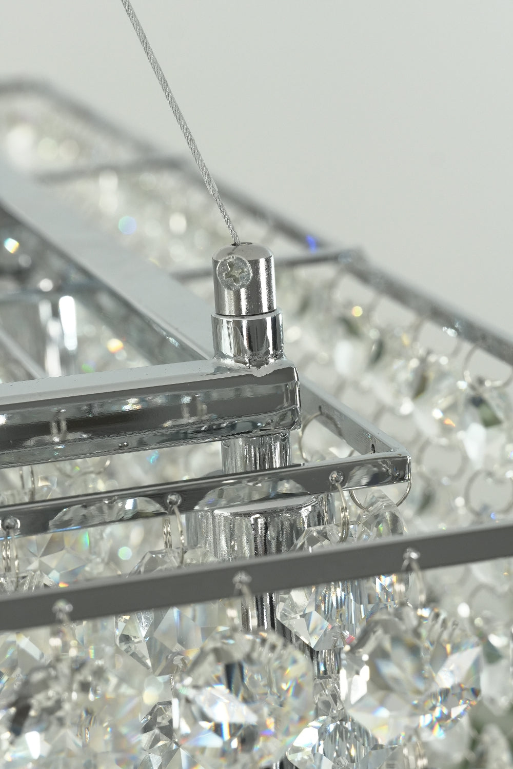 Suspension wire connection to the stainless steel frame | Stainless Steel | Detailed shot of the hardware and cable entry | Samu Lamp