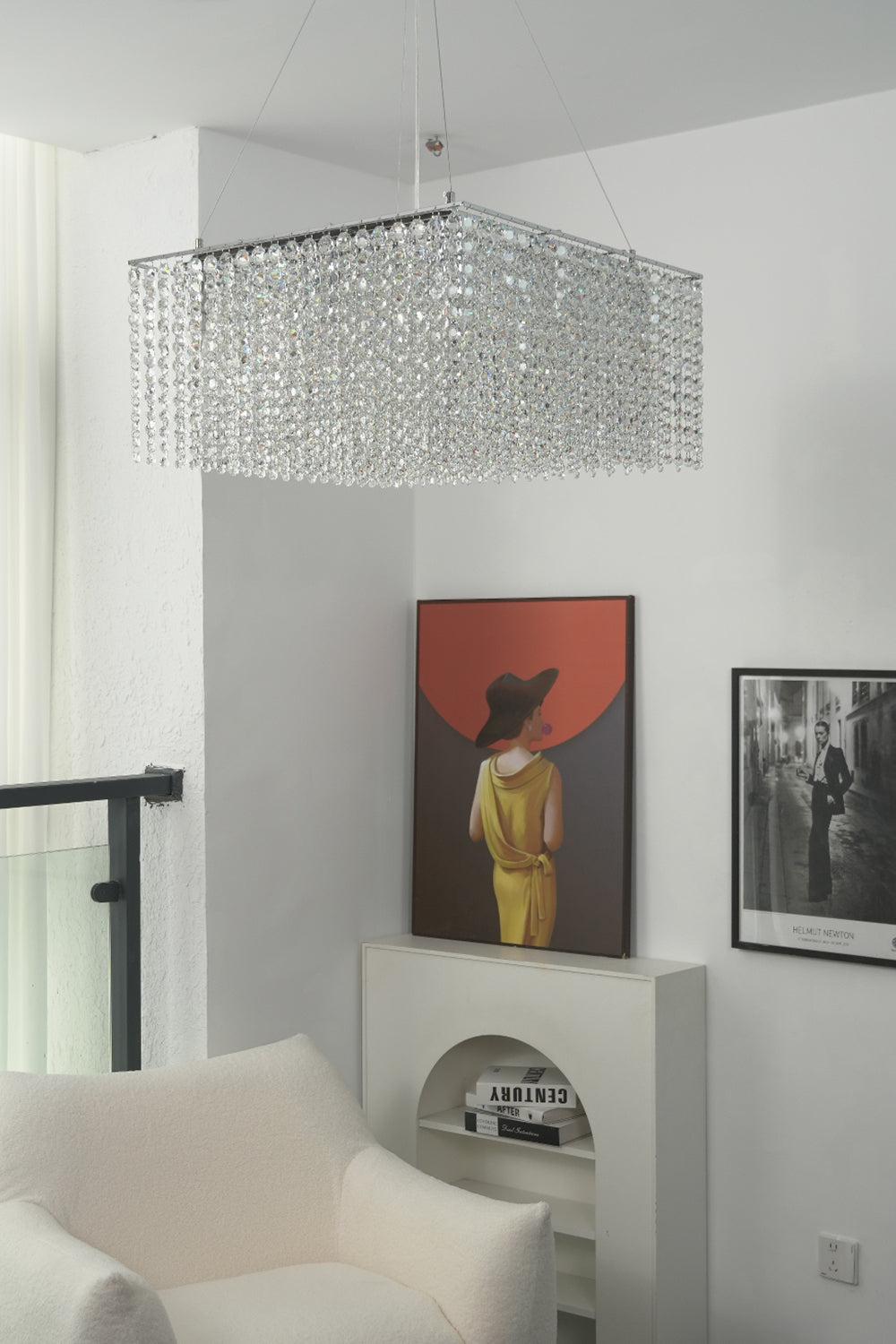 Sparkling crystal pendant light in a minimalist interior | Stainless Steel, Crystal | View from a hallway showing the chandelier and wall art | Samu Lamp