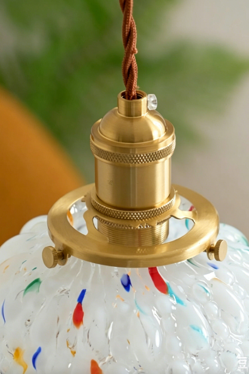 Speckled Bubble Glass Pendant Lamp | Glass, Metal | Close-up focus on the polished gold brass socket cap assembly sitting atop the textured bubble glass shade | Detail shot | Samu Lamp