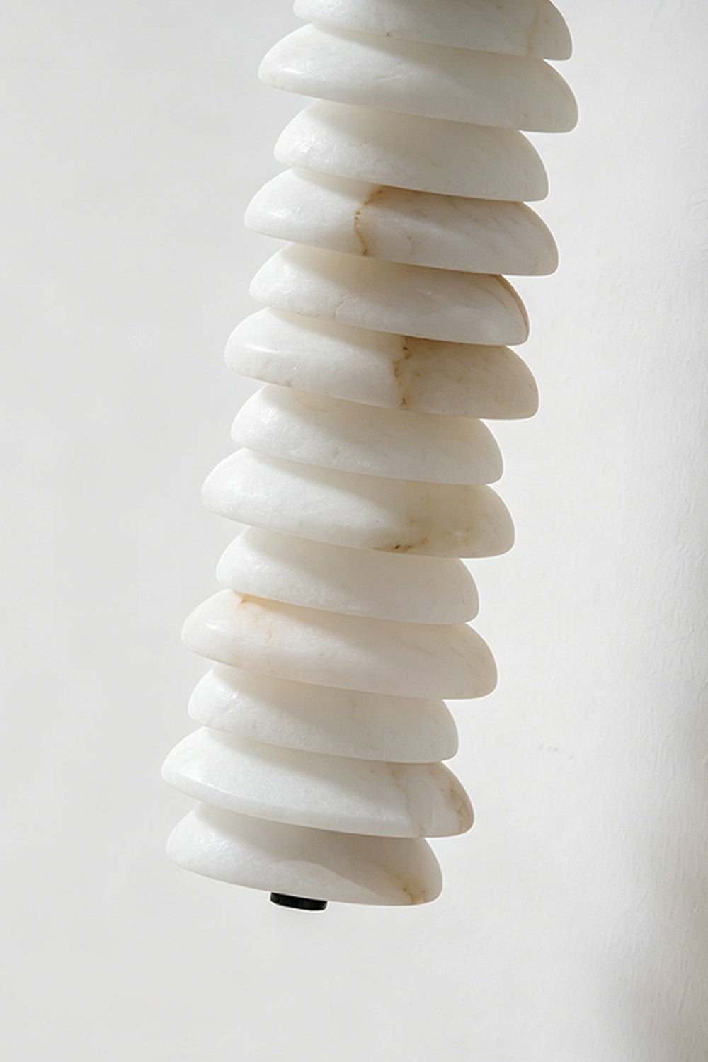 Stacked Strata Alabaster Wall Lamp | Alabaster, Metal | Lit product detail showing stacked layers and warm glow | Samu Lamp