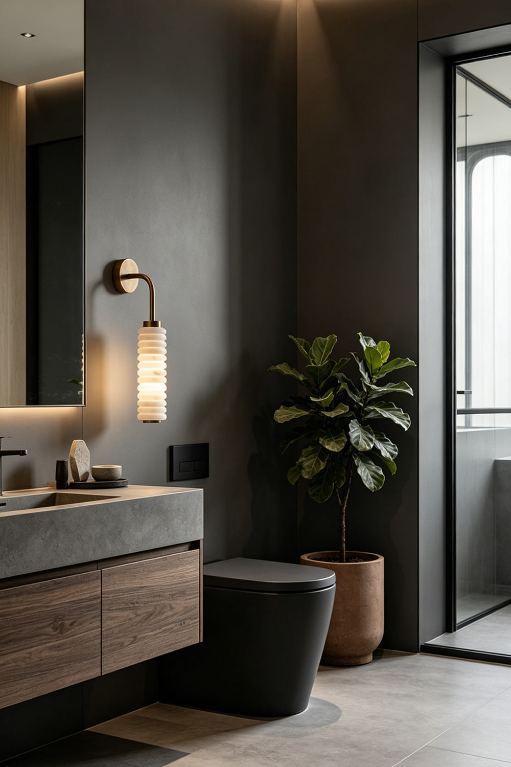 Stacked Strata Alabaster Wall Lamp | Metal, Alabaster | Lit lamp on grey wall in dark modern kitchen | Samu Lamp