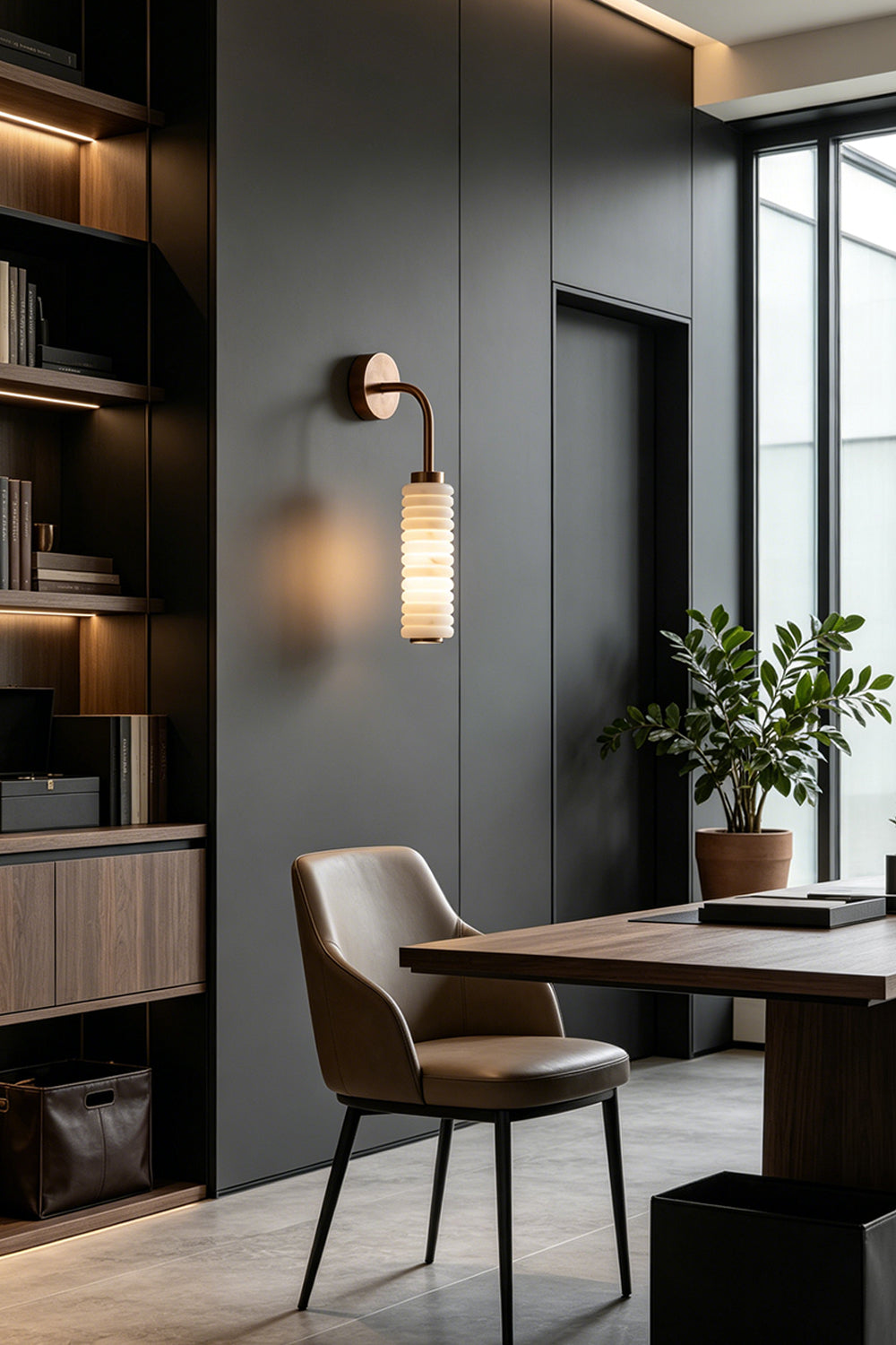 Stacked Strata Alabaster Wall Lamp | Metal, Alabaster | Lit lamp on grey wall in contemporary dining room | Samu Lamp