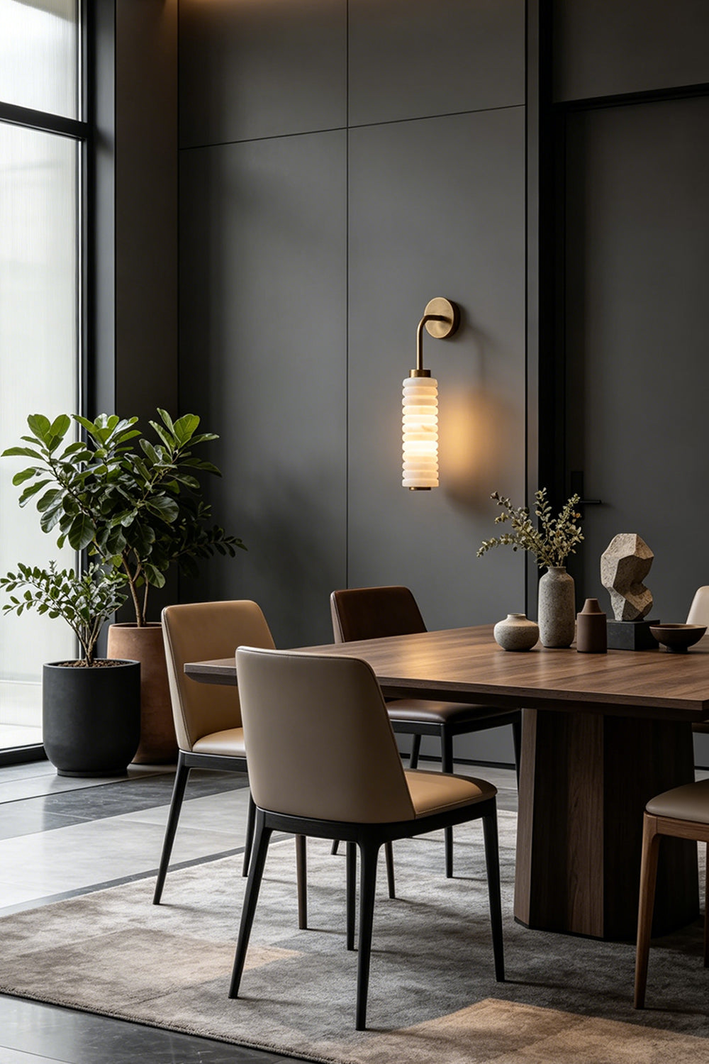 Stacked Strata Alabaster Wall Lamp | Metal, Alabaster | Lit lamp casting warm light in modern dining interior | Samu Lamp