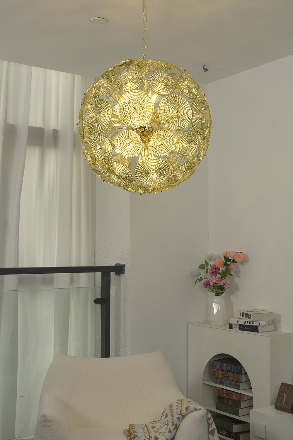 Detailed shot of lit glass spheres chandelier frame | Metal, Glass | Showing brass attachment and spheres structure | Samu Lighting