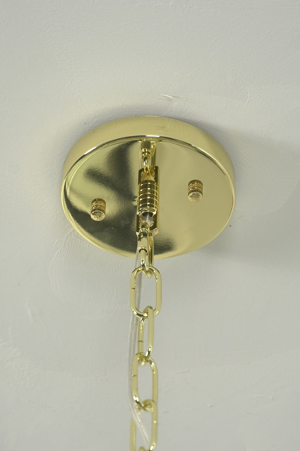 Brass ceiling canopy and chain detail | Metal | Showing functional connection and screws | Samu Lighting